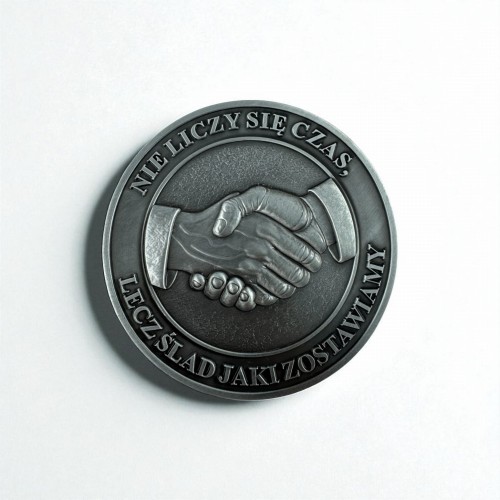 Medal odlewany dłonie
